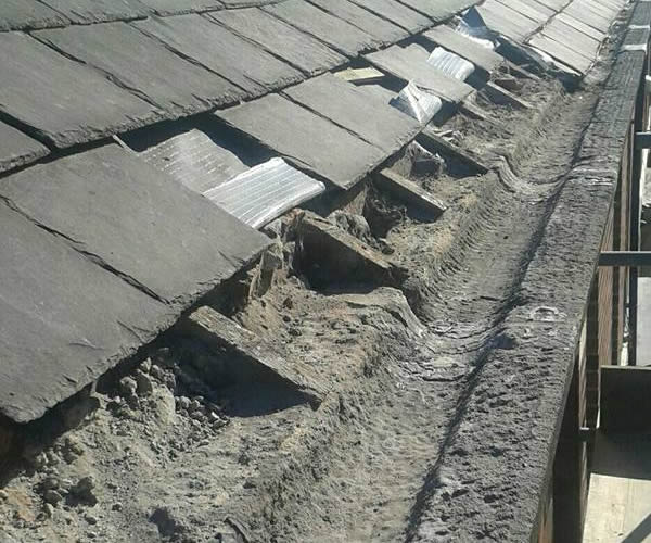 roofing work - stone guttering repairs before